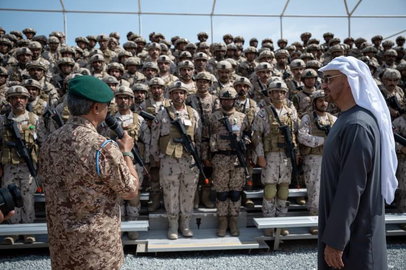 Sheikh Mohamed watches as Sultan Abdullah addresses military personnel at Al Hamra Camp