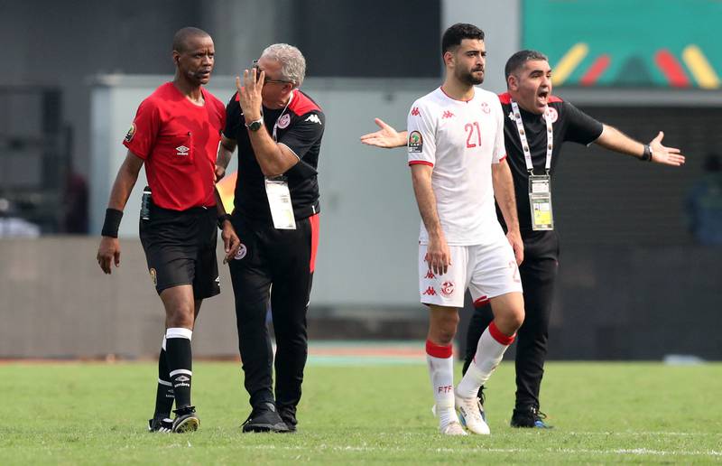 Tunisia manager Mondher Kebaier remonstrates with the referee Janny Sikazwe. Reuters