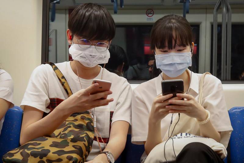 epa08248843 Commuters wearing protective face masks ride the underground or MRT (Metropolitan Rapid Transit) in Bangkok, Thailand, 26 February 2020. Thailand's Health Ministry is stepping up efforts to contain the spread of the novel coronavirus or COVID-19 after it reported three new cases of on 26 February, bringing the total number of infected people to 40. The Health Ministry is asking people to avoid unnecessary travel to 'At-risk countries' which include China, Macau, Hong Kong, Taiwan, South Korea, Singapore, Italy, Iran and Japan.  EPA/DIEGO AZUBEL
