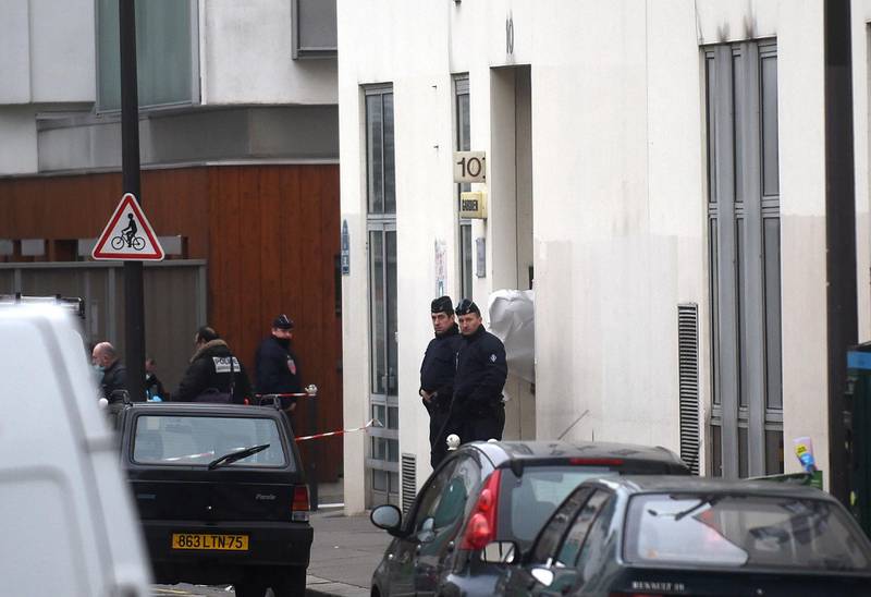PARIS, FRANCE - JANUARY 07:  Police officers guards the offices of the French satirical newspaper Charlie Hebdo on January 7, 2015 in Paris, France. Armed gunmen stormed the offices leaving twelve dead, including two police officers, according to French officials.  (Photo by Antoine Antoniol/Getty Images)