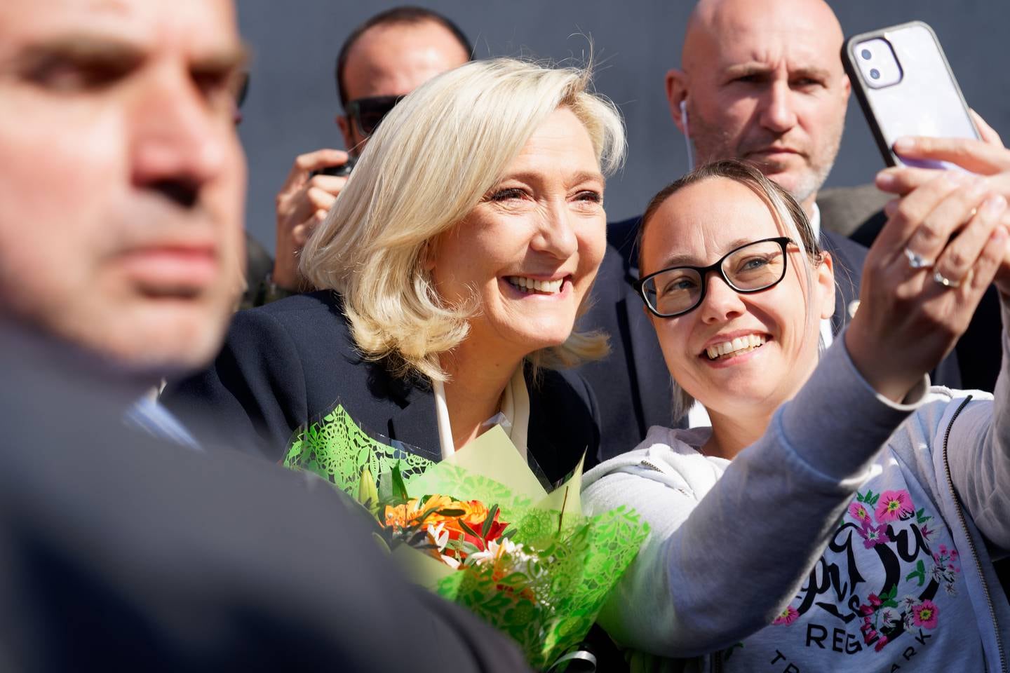 French far-right National Rally candidate Marine Le Pen poses with supporters as she leaves a polling station after casting her ballot for the second round of the presidential election in Henin-Beaumont on Sunday. Getty Images