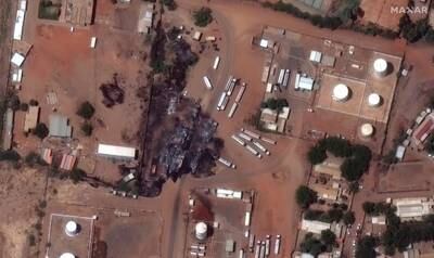 Destroyed fuel trucks at a depot in Khartoum. Reuters