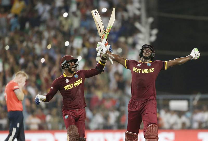 West Indies Carlos Brathwaite, right, celebrates with teammate Marlon Samuels after they defeated in England in the final of the 2016 T20 World Cup at Eden Gardens in Kolkata, India, on Sunday, April 3. AP