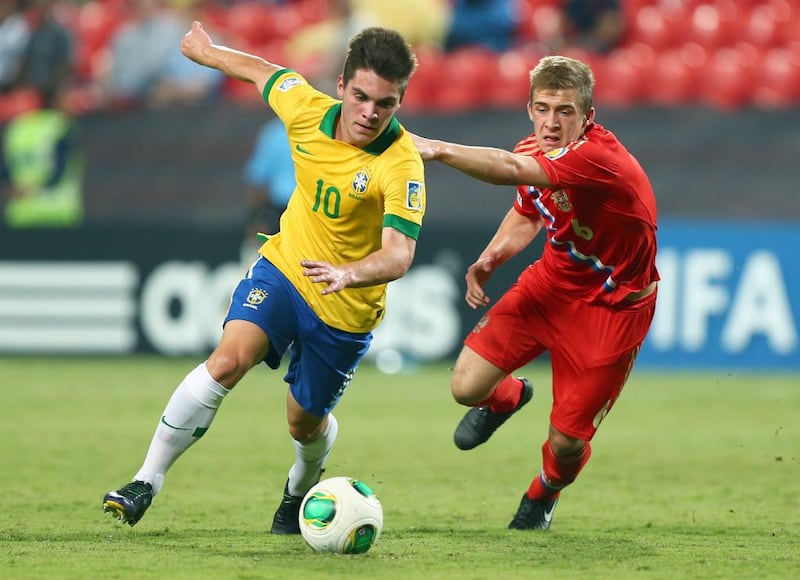 Nathan, left, orchestrated most of Brazil’s attacks, while Dimitriy Barinov, right, was sent off for Russia. Marwan Naamani / AFP

