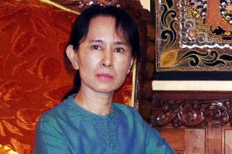 This file handout picture taken on January 30, 2008 shows Myanmar's pro-democracy leader Aung San Suu Kyi meeting with the (unseen) junta's appointed labour minister, Aung Kyi, in Yangon.