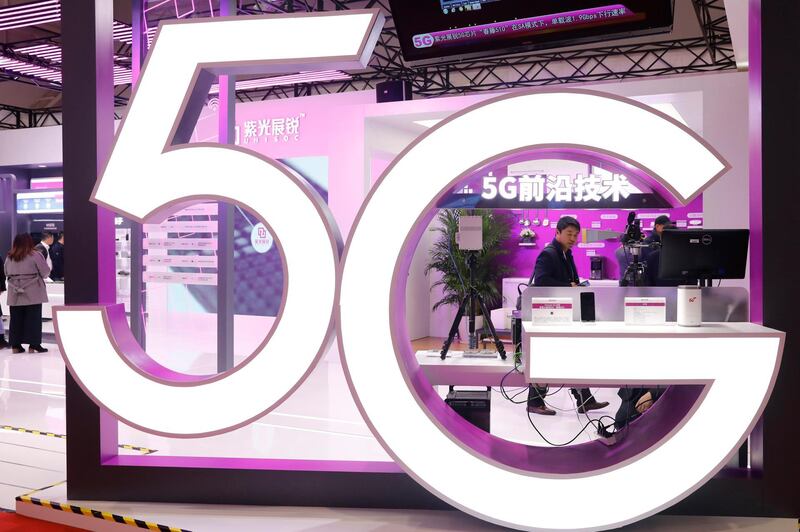 epa08013765 A 5G logo hangs from a pavilion at the 2019 World 5G Convention in Beijing, China, 21 November 2019. The event runs from 20 through to 23 November 2019. China has built over 100,000 5G base stations around the country.  EPA/WU HONG