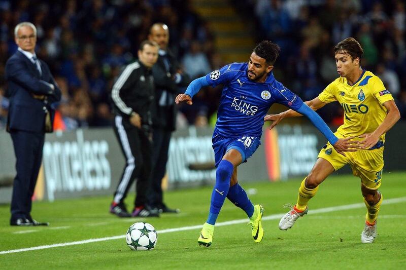 Riyad Mahrez, left, of Leicester City in action against FC Porto’s Oliver Torres. Tim Keeton / EPA