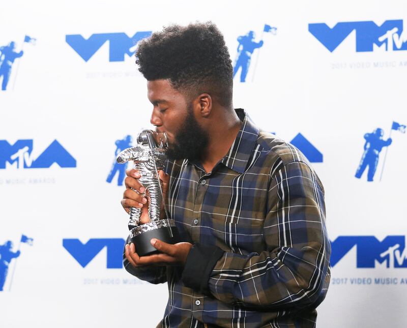 Khalid poses with the Best New Artist award. Danny Moloshok / Reuters