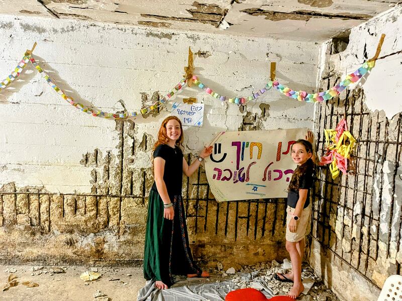 Raz and Shiri Rabinovich decorate the bomb shelter near their home after schools in Israel shut this week. Photo: Rabinovich family