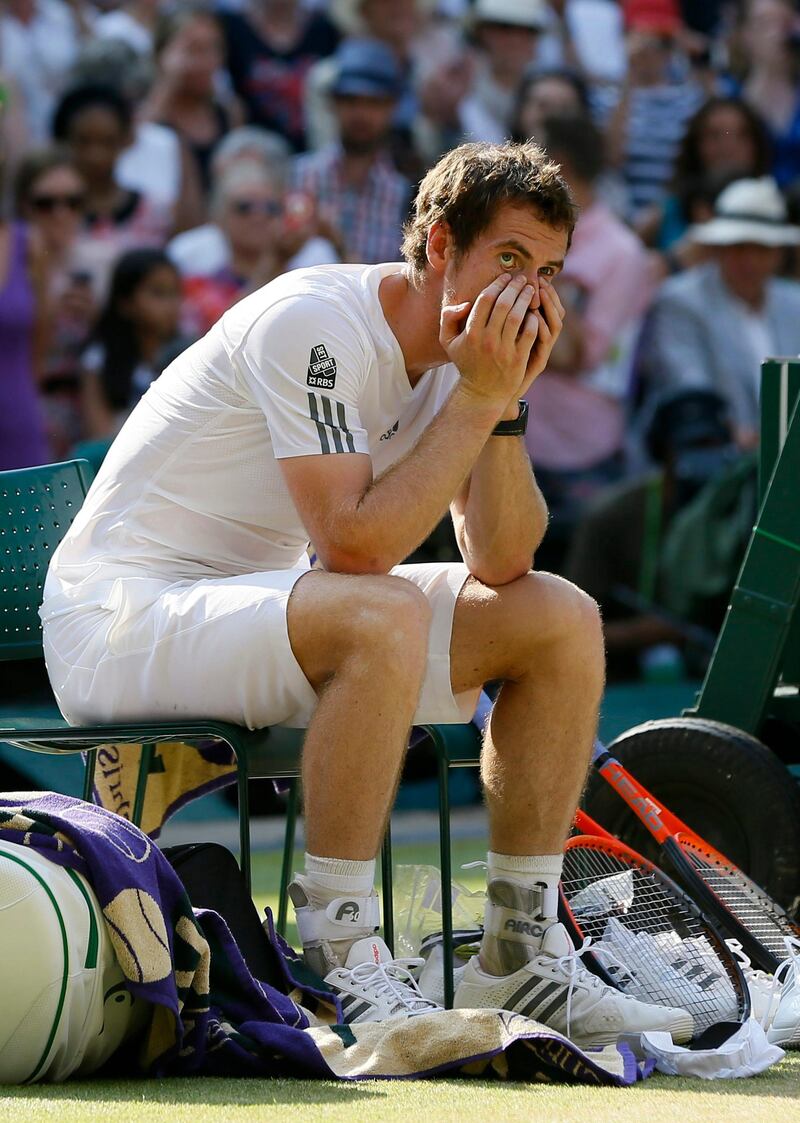 Andy Murray of Britain reacts before the trophy presentation after defeating Novak Djokovic of Serbia during the Men's singles final match at the All England Lawn Tennis Championships in Wimbledon, London, Sunday, July 7, 2013. (AP Photo/Kirsty Wigglesworth)  *** Local Caption ***  Britain Wimbledon Tennis.JPEG-0745a.jpg