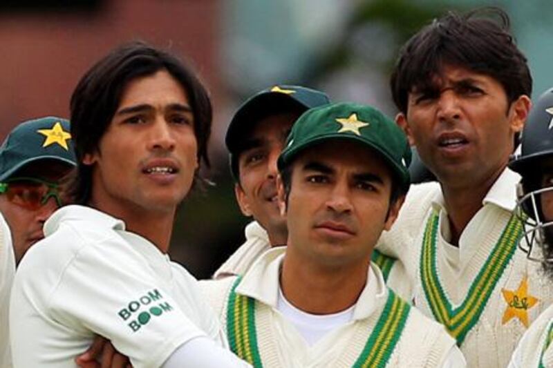 LONDON, ENGLAND - AUGUST 27: (L-R) Mohammad Amir, captain Salman Butt and Mohammad Asif of Pakistan watch the big screen replay shortly before Paul Collingwood of England was given out lbw by the TV umpire during day two of the 4th npower Test Match between England and Pakistan at Lord's on August 27, 2010 in London, England.  (Photo by Clive Rose/Getty Images)