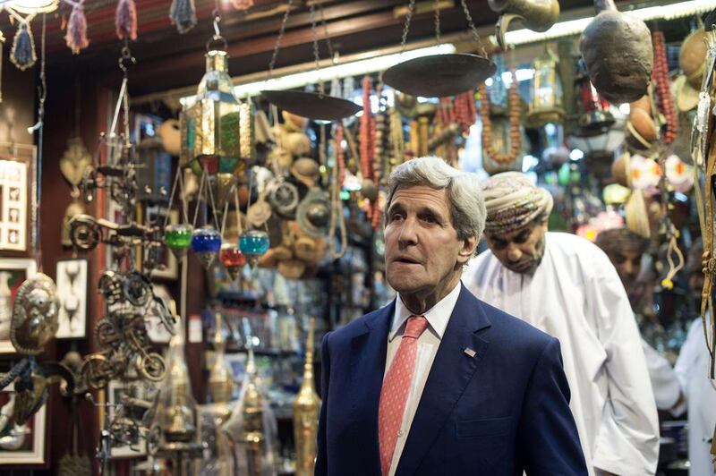 Mr Kerry leaves a shop as he visits the Mattrah souk in Muscat on Monday. Iran and the United States held a second day of talks in Oman about a long hoped for nuclear deal, with key differences threatening to scupper a final agreement. Nicholas Kamm / AP