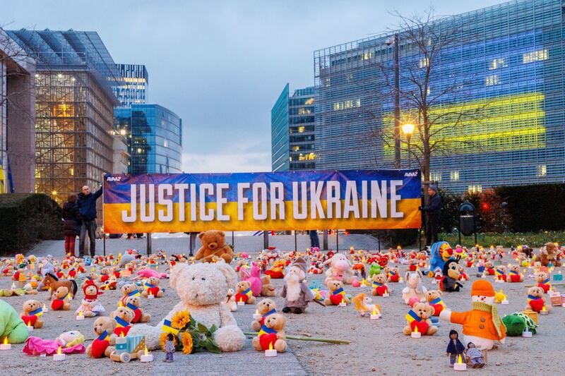 Teddy bears and other toys left by Ukrainian refugees and members of the Avaaz global activist network at Schuman Roundabout, in front of the European Commission, in Brussels. AP