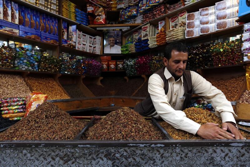 A Yemeni vendor displays sun-dried raisins for sale ahead of Eid Al Fitr, marking the end of the Muslim fasting month of Ramadan, at a market in the old quarter of Sana'a, Yemen.  EPA