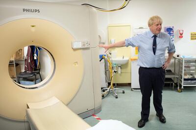 HARLOW, ENGLAND - SEPTEMBER 27: Prime Minister Boris Johnson meets staff and sees an MRI CT Scanner during a visit to the Princess Alexandra hospital for an announcement on new patient scanning equipment on September 27, 2019 in Harlow, United Kingdom. The Prime Minister is pledging an overhaul to cancer screening, with the funding providing 300 diagnostic machines in hospitals across England. (Photo by Stefan Rousseau - WPA Pool/Getty Images)