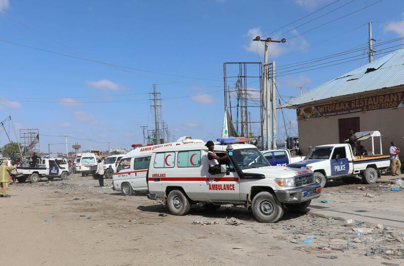 An ambulance drives from the scene of a car bomb explosion. Reuters