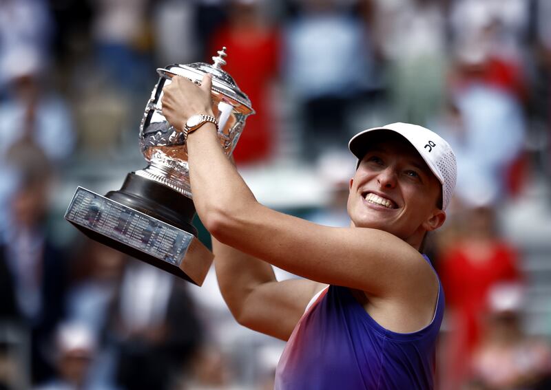 Iga Swiatek with the Suzanne-Lenglen trophy after beating Jasmine Paolini in the French Open final at Roland Garros in Paris, on June 8, 2024. EPA