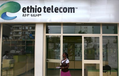 FILE PHOTO: A woman walks past an Ethio Telecom office in Ethiopia's capital, Addis Ababa, November 9, 2015. REUTERS/Tiksa Negeri/File Photo