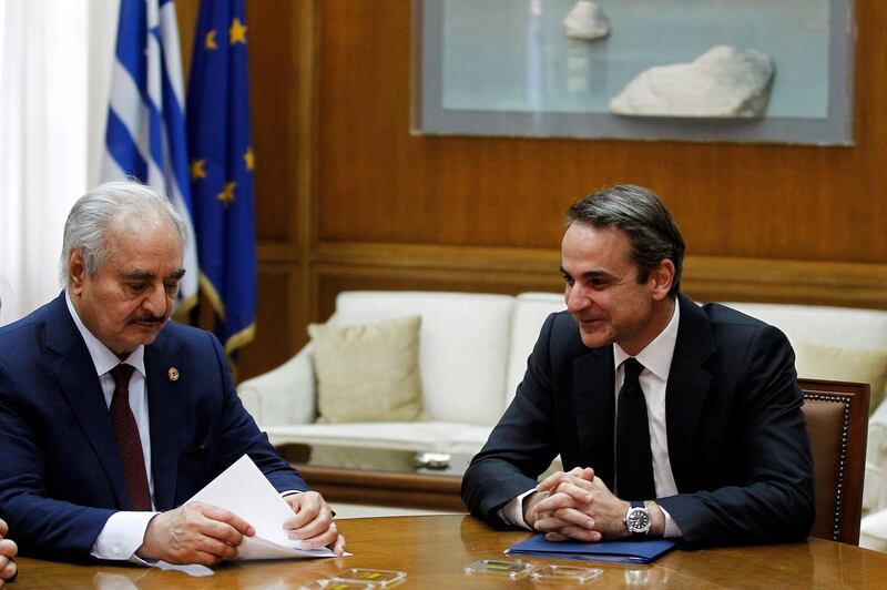 epa08135644 Greek Prime Minister Mitsotakis (R) talks with Commander of the Libyan National Army (LNA) Khalifa Haftar (L) during their meeting in Parliament, in Athens, Greece, 17 January 2020. 'We are pacifists. We have come here to talk about peace,' Libyan National Army Commander Khalifa Haftar said on Friday as he arrived for a meeting with Prime Minister Kyriakos Mitsotakis, at the prime minister's offices in parliament. Earlier, Haftar had a meeting with Greek Foreign Minister Nikos Dendias.  EPA/ALEXANDROS VLACHOS