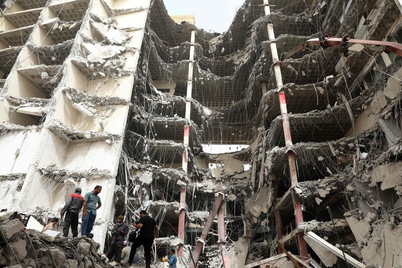 Iranians gather at the site where a 10-storey building collapsed in the south-western city of Abadan. At least six people died and dozens were injured, officials said. AFP