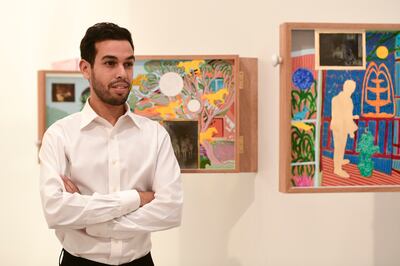 Ilyes Messaoudi with his painted-glass pieces, represented at Abu Dhabi Art by Foreign Agent. Khushnum Bhandari / The National