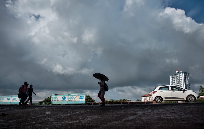 Monsoon clouds fill the sky as residents in India's Kerala state seek shelter form the rain.