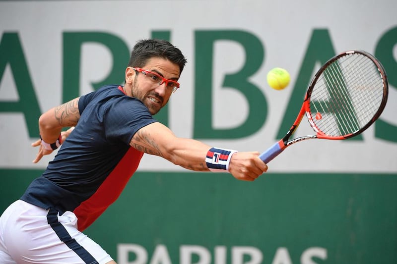 Serbia’s Janko Tipsarevic returns the ball to Canada’s Milos Raonic during their men’s first round match at the Roland Garros 2016 French Tennis Open in Paris on May 23, 2016. Martin Bureau / AFP