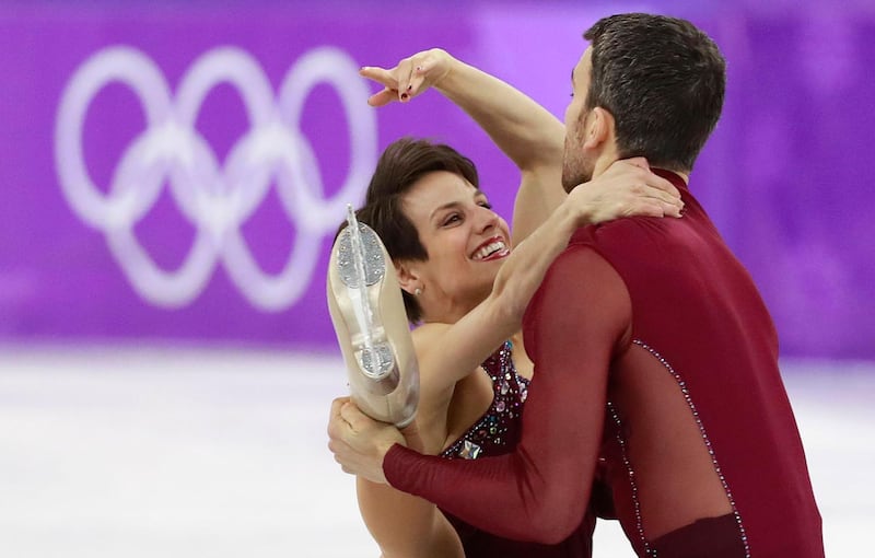 Bronze medalists Meagan Duhamel and Eric Radford of Canada react compete during of the Pair Free Skating in the Figure Skating competition at the Gangneung Ice Arena. How Hwee Young / EPA