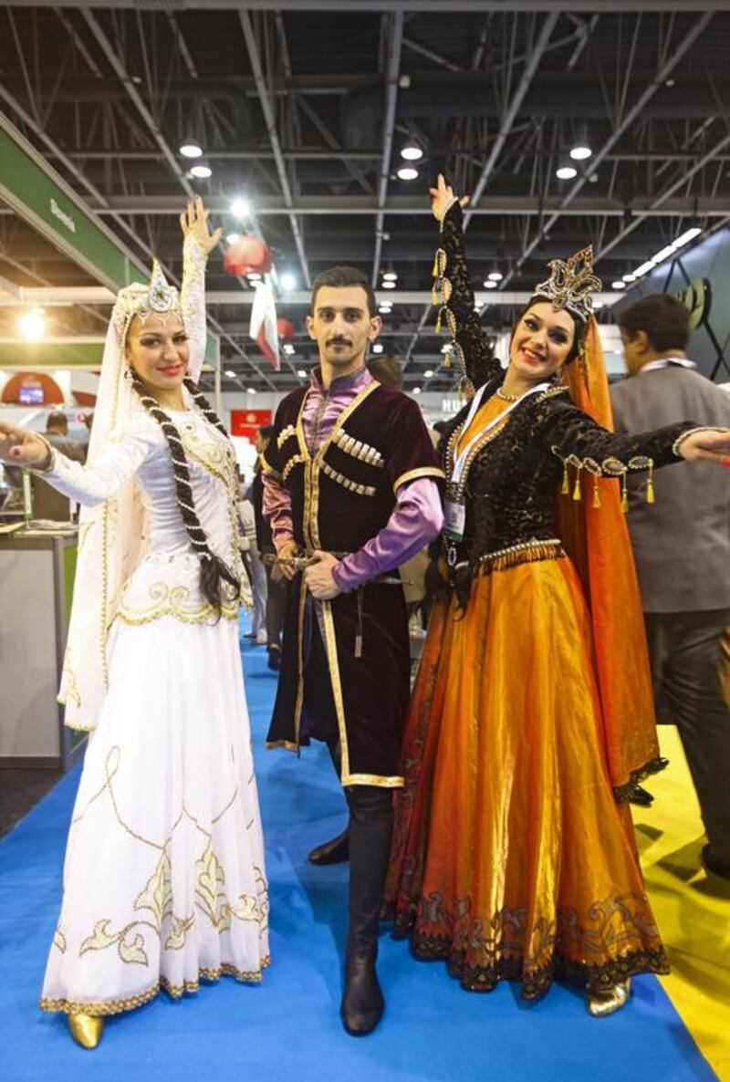 Nigar, Ruslan, and Olga – this Azerbaijani trio are celebrating the twin Ural traditions of braids and facial hair. Ruslan is armed with a real dagger, to defend himself against the many dangers confronting an exhibitor at the Arabian Travel Market. Lee Hoagland / The National