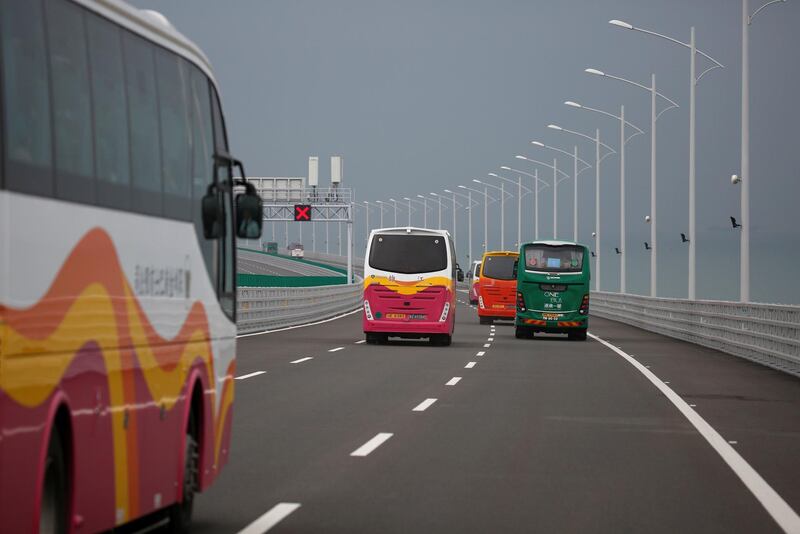 Buses drive on the Hong Kong-Zhuhai-Macau Bridge. Reuters