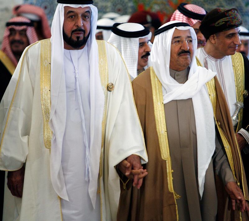 Kuwaiti leader, Sheikh Sabah al-Ahmad al-Sabah (R), arrives with UAE president, Sheikh Khalifa bin Zayed al-Nahayan (L), at the final session of the Gulf Cooperation Council (GCC) summit in Kuwait City on December 15, 2009. Leaders of the energy-rich Gulf states ended a two-day summit by voicing confidence over the ability of their economies to overcome the impact of the global economic crisis. AFP PHOTO/YASSER AL-ZAYYAT (Photo by YASSER AL-ZAYYAT / AFP)