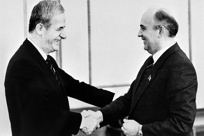 General Secretary of the Communist Party of the Soviet Union Mikhail Gorbachev (right) shaking hands with Syrian President Hafez Al Assad in Moscow on June 19, 1985. AFP