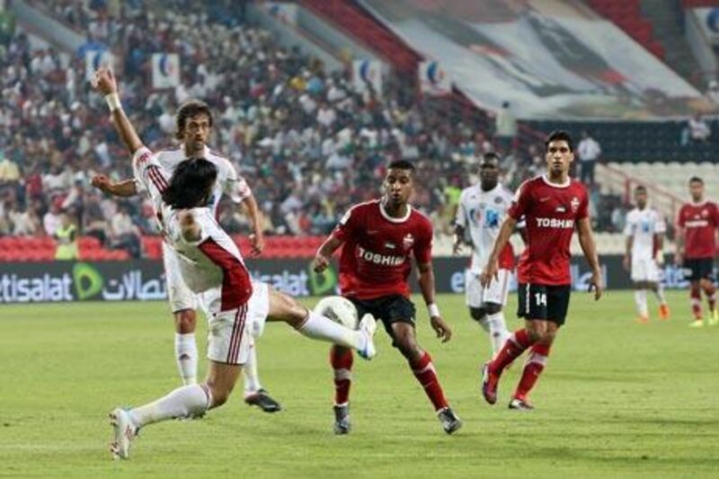 Al Jazira, in white, capitalised on Al Ahli’s errors last night to kick-start their Pro League title defence in emphatic fashion.