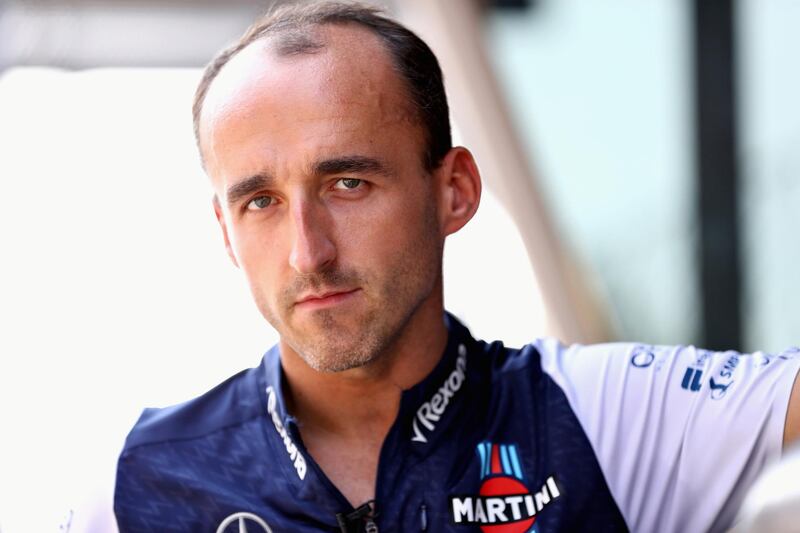 MONZA, ITALY - AUGUST 30:  Robert Kubica of Poland and Williams talks on the pit wall during previews ahead of the Formula One Grand Prix of Italy at Autodromo di Monza on August 30, 2018 in Monza, Italy.  (Photo by Mark Thompson/Getty Images)