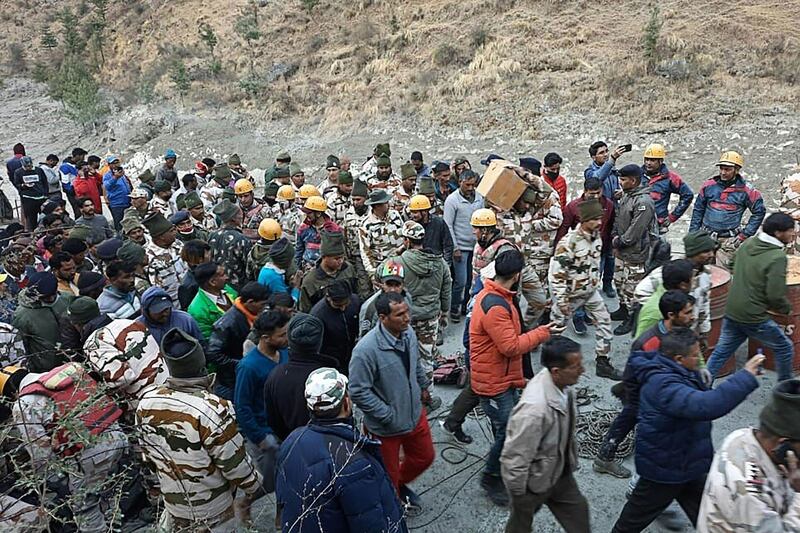 Civilians and members of the Indo-Tibetan Border Police during rescue operations at Reni village in the Chamoli district of Uttarakhand. AFP