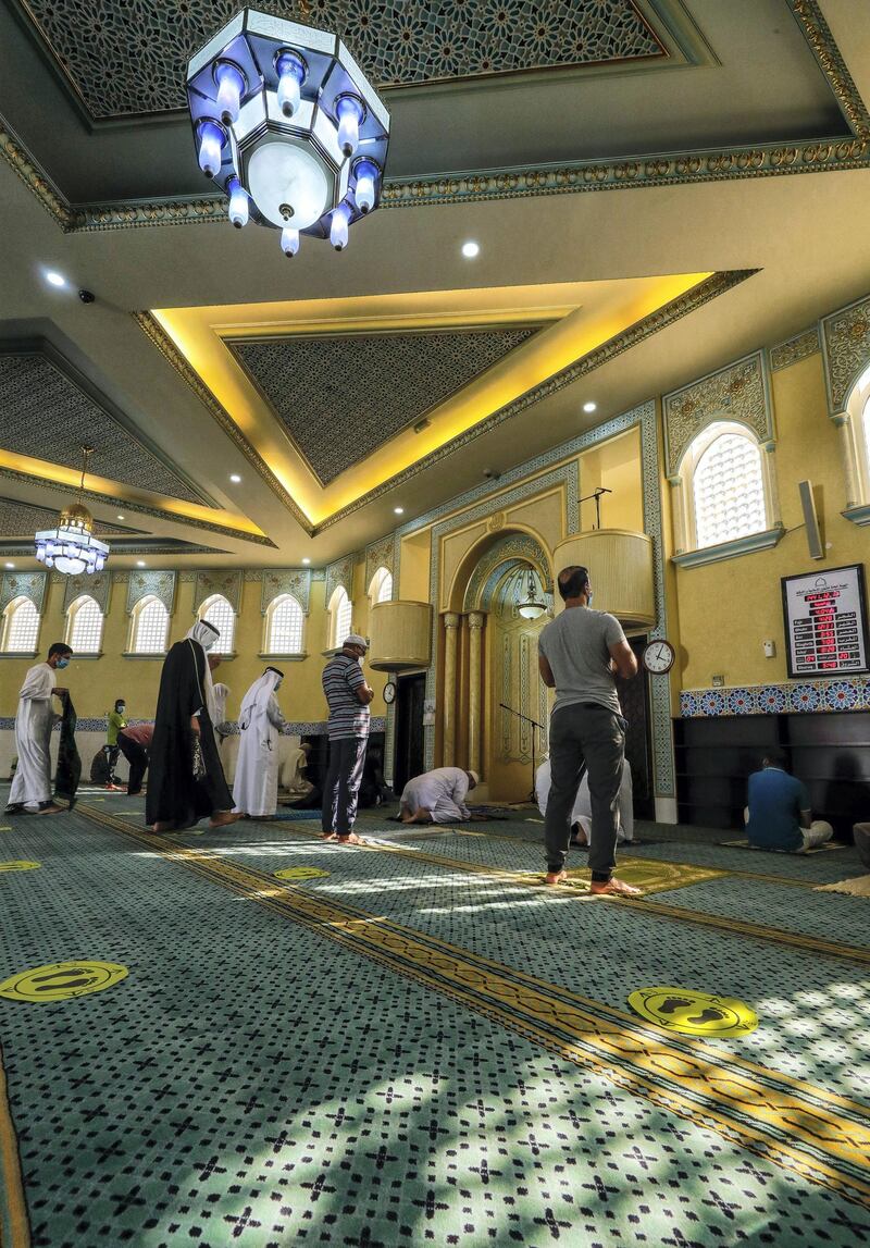 Abu Dhabi, United Arab Emirates, August 3, 2020.   
Worshippers at the Bani Hashim Mosque at the Al Maqta area during the first day restrictions have been eased on Mosque's in Abu Dhabi to allow 50% occupancy.
Victor Besa /The National
Section: NA
Reporter: