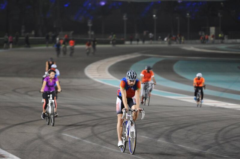 Cyclists circle the F1 track In anticipation of the upcoming Abu Dhabi Tour, several Abu Dhabi residents were out in droves to participate in Train Yas on the F1 Circuit on Tuesday night, September 29, 2015. (DELORES JOHNSON/The National)