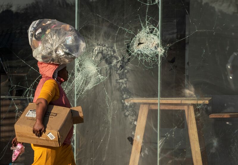 Glass is broken at a KFC restaurant at Naledi shopping complex in Vosloorus, east of Johannesburg.