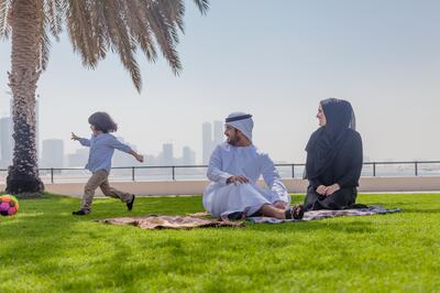 Traditional Young Arabic family having fun outdoors at picnic *** Local Caption ***  GettyImages-495050490.jpg