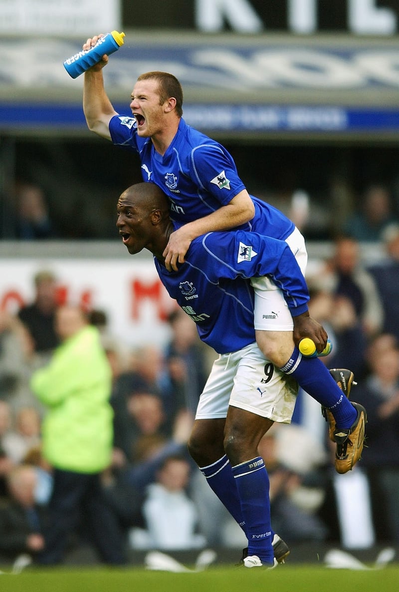 LIVERPOOL - 19 OCTOBER:  Wayne Rooney of Everton celebrates with Keven Campbell after scoring the winner in the FA Barclaycard Premiership match between Everton and Arsenal at Goodison Park in Liverpool on October 19, 2002. Everton won 2-1. (photo by Shaun Botterill/Getty Images.)