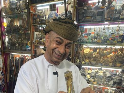 Akhtar Al Belooshi, owner of a 105-year-old shop at Oman's Muttrah Souq displaying his Dh360,000 dagger. Credit: Ali Al Shouk