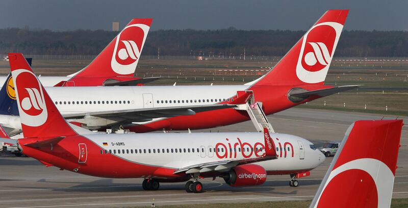 FILE - In this April 2, 2014 file photo airplanes of the German airline 'Air Berlin' are pictured at the Tegel airport in Berlin, Germany. Bankrupt German airline Air Berlin said Monday, Oct. 9, 2017  itâ€™s preparing to end flights at the end of October.  (AP Photo/Michael Sohn, file)