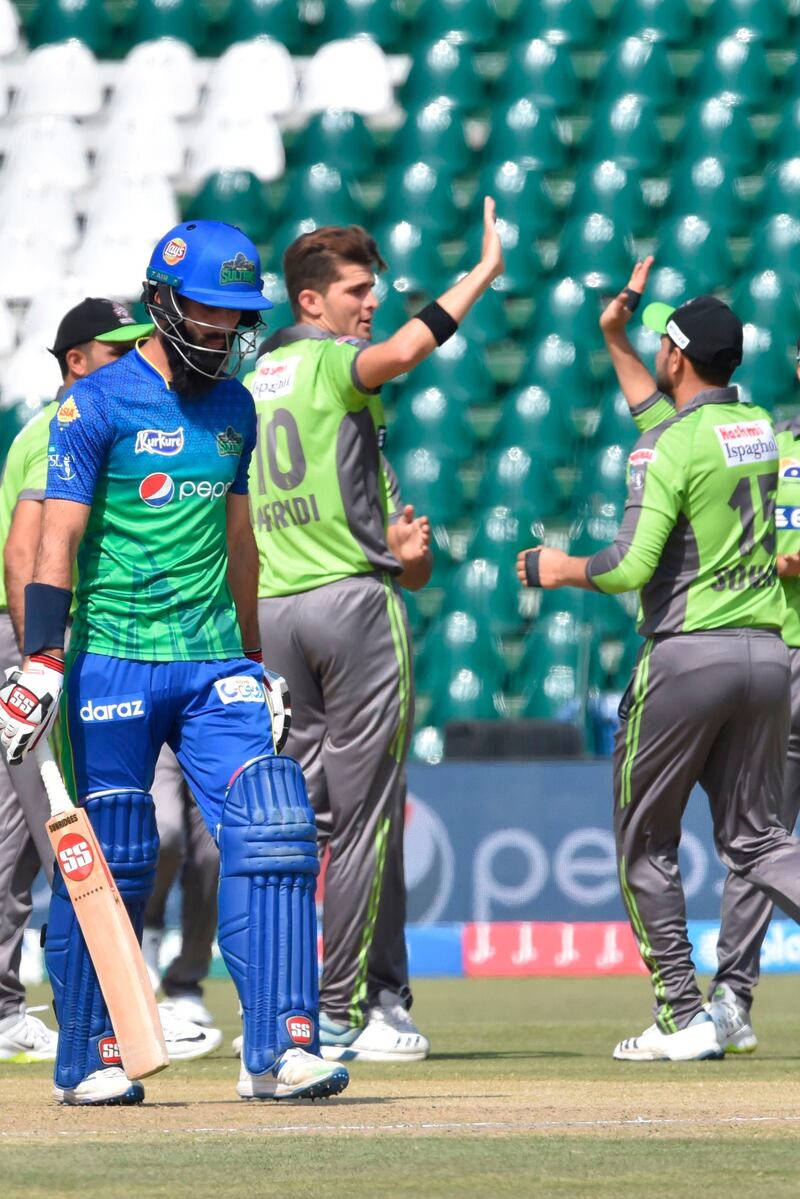 Multan Sultans batsman Moeen Ali walks back to the pavilion after his dismissal. AFP