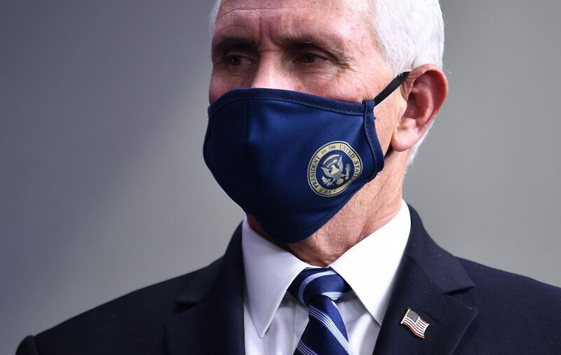 (FILES) In this file photo taken on November 19, 2020 Vice President Mike Pence listens during a White House Coronavirus Task Force press briefing in the James S. Brady Briefing Room of the White House. US Vice President Mike Pence and his wife will get the Covid-19 vaccine Friday in a public display designed to boost national confidence, the White House announced on December 16, 2020. / AFP / Brendan Smialowski
