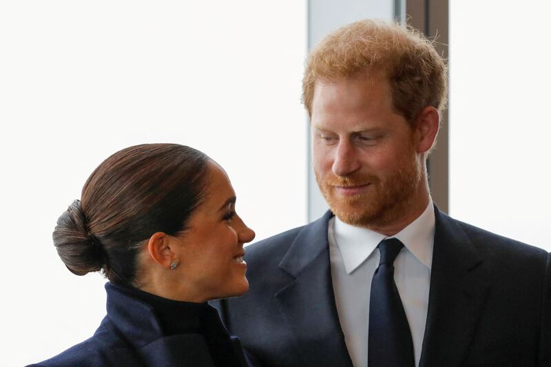 The book claims Prince Harry insisted Meghan joined him in Scotland following the queen’s death, which “did not go down well with his family". Reuters