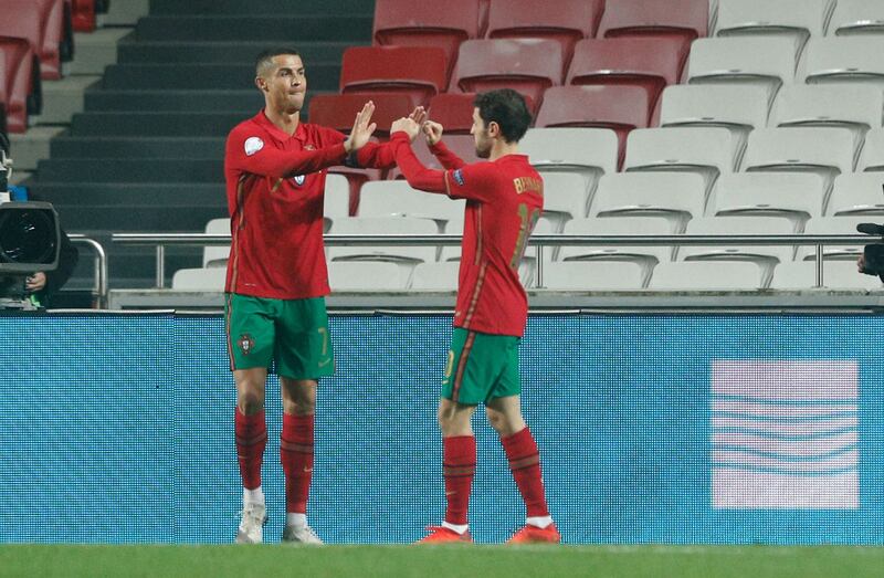 Mandatory Credit: Photo by ANTONIO COTRIM/EPA-EFE/Shutterstock (11012312al)
Portuguese player Cristiano Ronaldo (L) celebrates with teammate Bernardo Silva after scoring 6-0 lead during the friendly soccer match between Portugal and Andorra, held at Luz stadium in Lisbon, Portugal, 11 November 2020.
Portugal vs Andorra, Lisbon - 11 Nov 2020