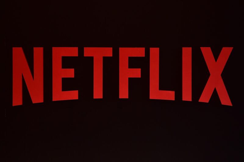 (FILES) In this file photo taken on March 1, 2017 the Netflix logo is pictured during a Netflix event in Berlin. 
Traditional television titans are bulking up in a battle with online streaming giants Netflix and Amazon as viewers take to binging on shows when and where they want. The latest evidence was the surprise move this week by US cable giant Comcast to outbid Rupert Murdoch's 21st Century Fox for pan-European satellite TV group Sky with an all-cash offer valued at more than $31 billion (25 billion Euros).
 / AFP PHOTO / John MACDOUGALL
