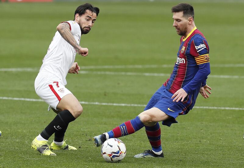 Barcelona's Lionel Messi and Suso of Sevilla. EPA