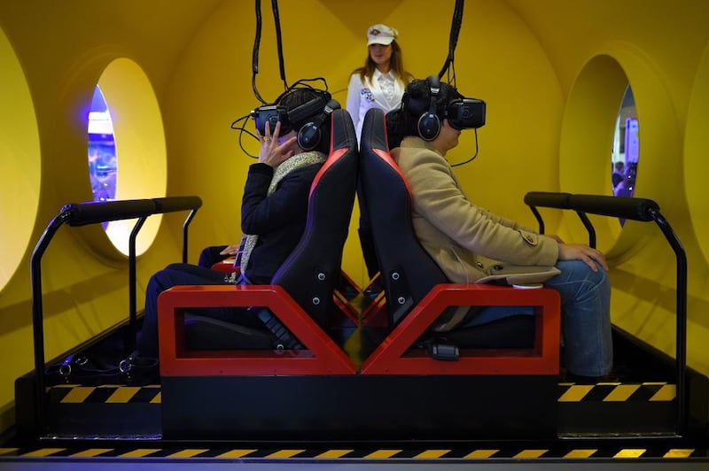 Visitors test the Oculus VR device. Virtual reality has a long way to go yet. Lluis gene / AFP