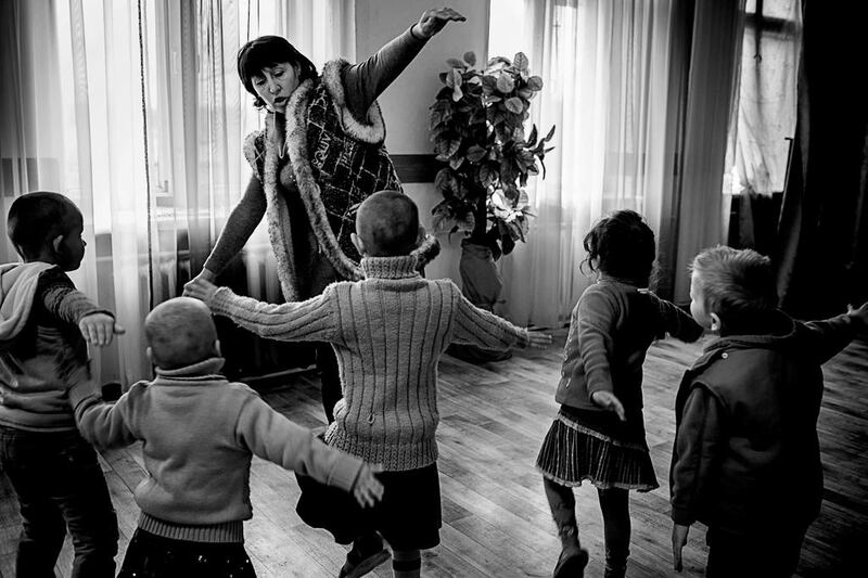 Psychologist Valentina Eremicheva leads a therapy lesson at the Centre for Social and Psychological Rehabilitation for Children, in the town of Dzerzhinsk, near the front line. Photo by Alex Masi.